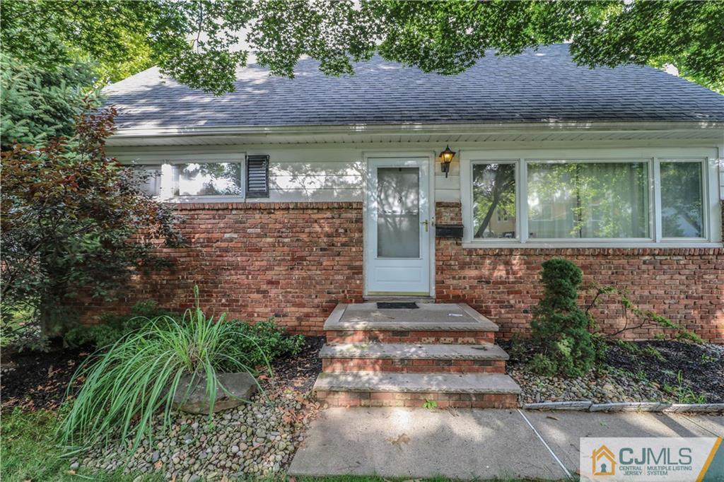 8 Kelly Street Metuchen, NJ 08840 - Photo 5 of 25 a front view of a house with garden