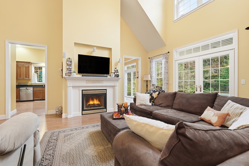 113 Greenwich Plains Road Ware, MA 01082 - Photo 14 of 42 a living room with furniture a flat screen tv and a fireplace