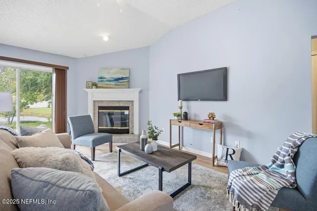 a living room with furniture and a flat screen tv