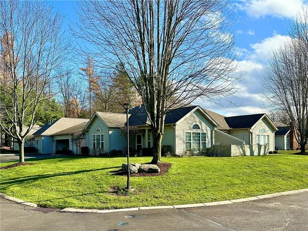 a front view of house with yard porch and green space