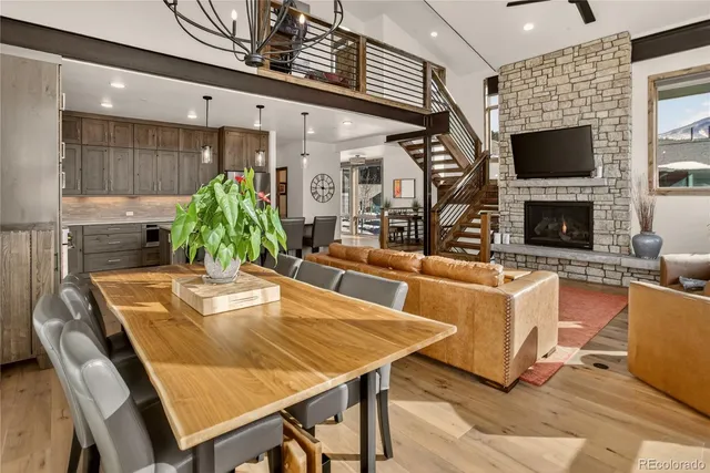 a dining room with furniture and a flat screen tv