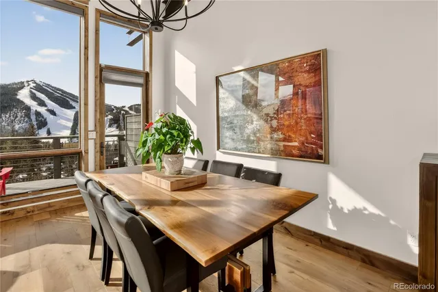a view of a dining room with furniture window and outside view