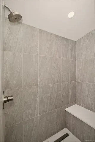 a bathroom with a shower and a toilet