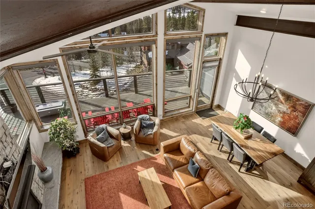 a view of a balcony with chairs and potted plants