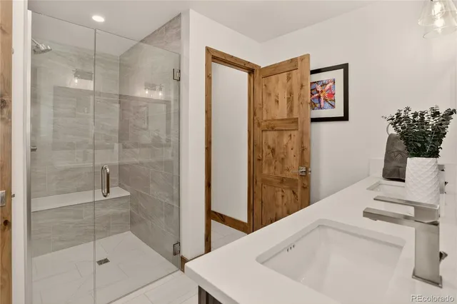 a bedroom with a bed window and a table