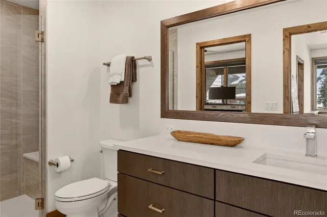 a bathroom with a tub and shower