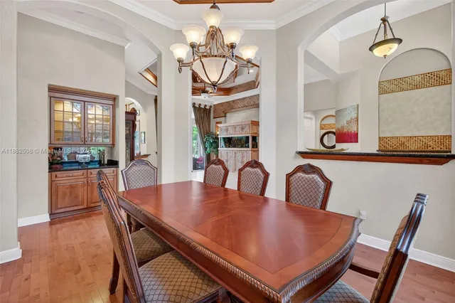 a kitchen with a sink a stove and cabinets