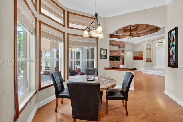 a living room with furniture a large window and a flat screen tv