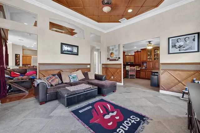 a living room with a large window and table