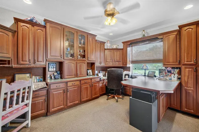 a view of walk in closet with clothes