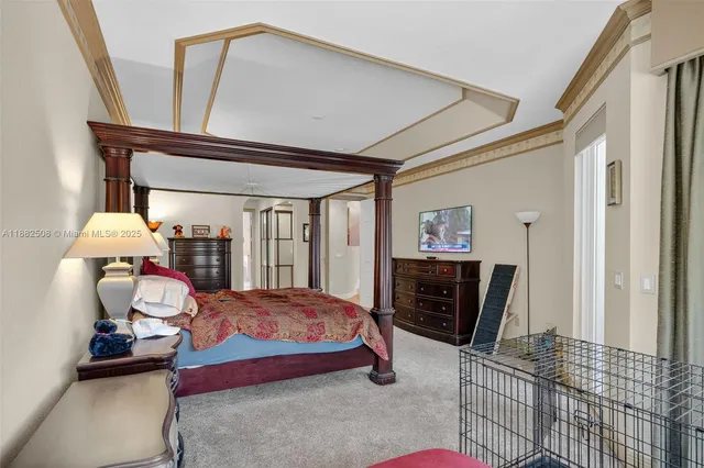 a front view of a house with garden and trees