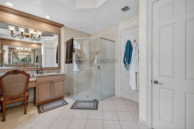 an aerial view of a house with a yard basket ball court and outdoor seating