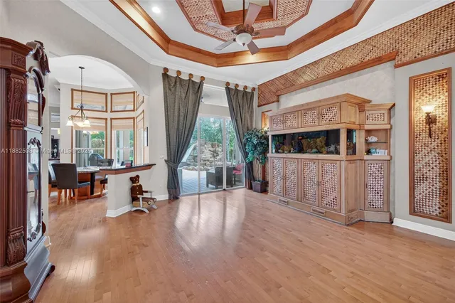 a view of a dining room with furniture and wooden floor