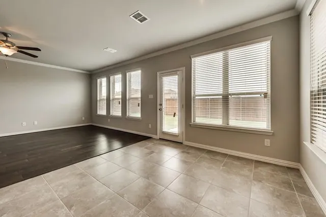 a view of an empty room with glass windows