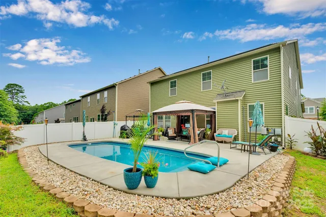 a view of a house with a swimming pool