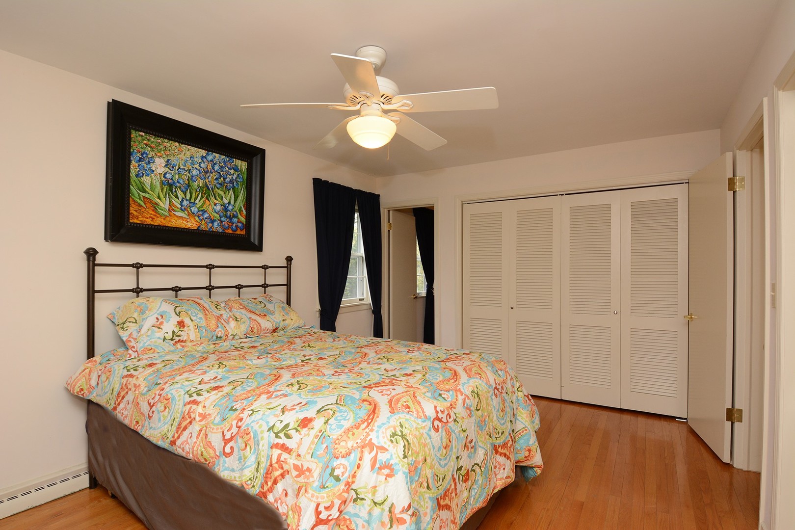 455 Lombard Road Itasca, IL 60143 - Photo 22 of 35 a bed sitting in a bedroom next to a window