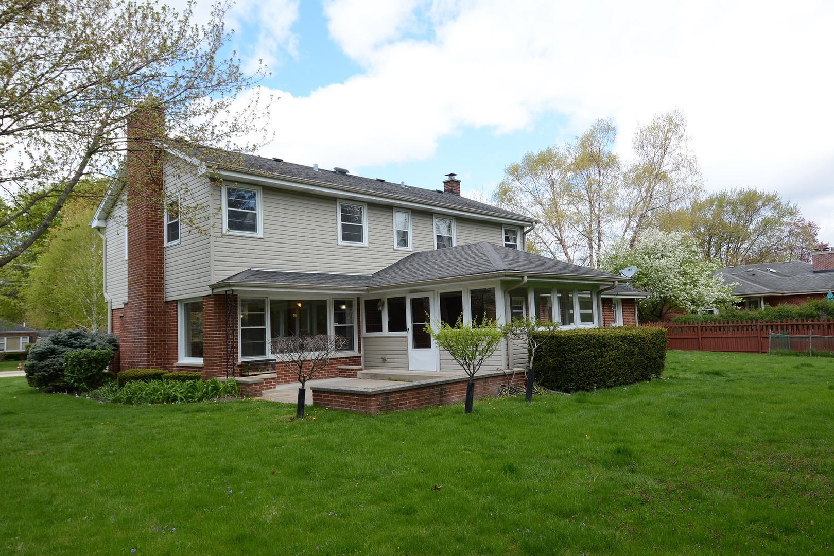 455 Lombard Road Itasca, IL 60143 - Photo 33 of 35 a white house that has garden in front of it