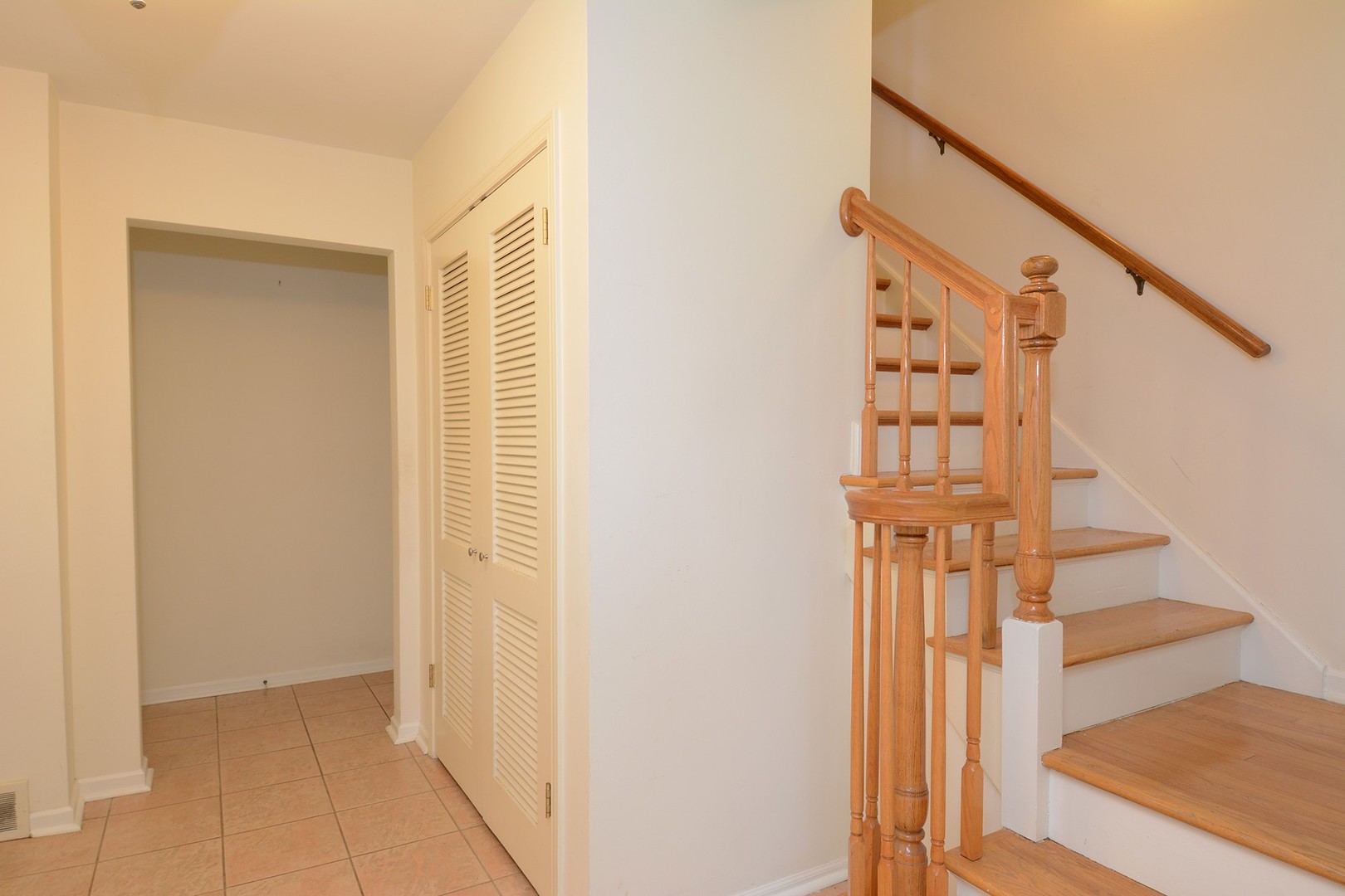 455 Lombard Road Itasca, IL 60143 - Photo 8 of 35 a view of entryway with wooden floor and stairs