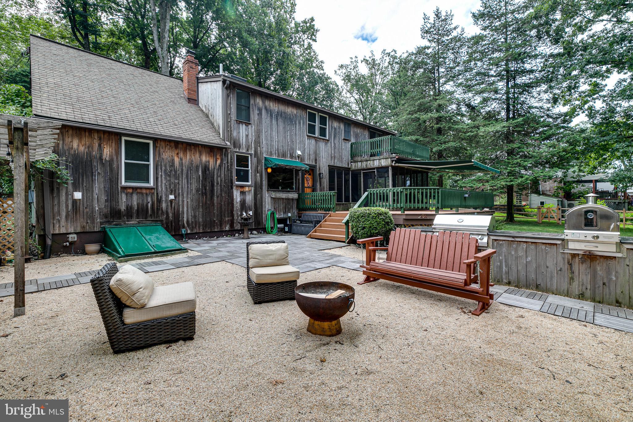 3366 Pine Road Huntingdon Valley, PA 19006 - Photo 41 of 48 Rear social area, firepit, grill, and pizza oven