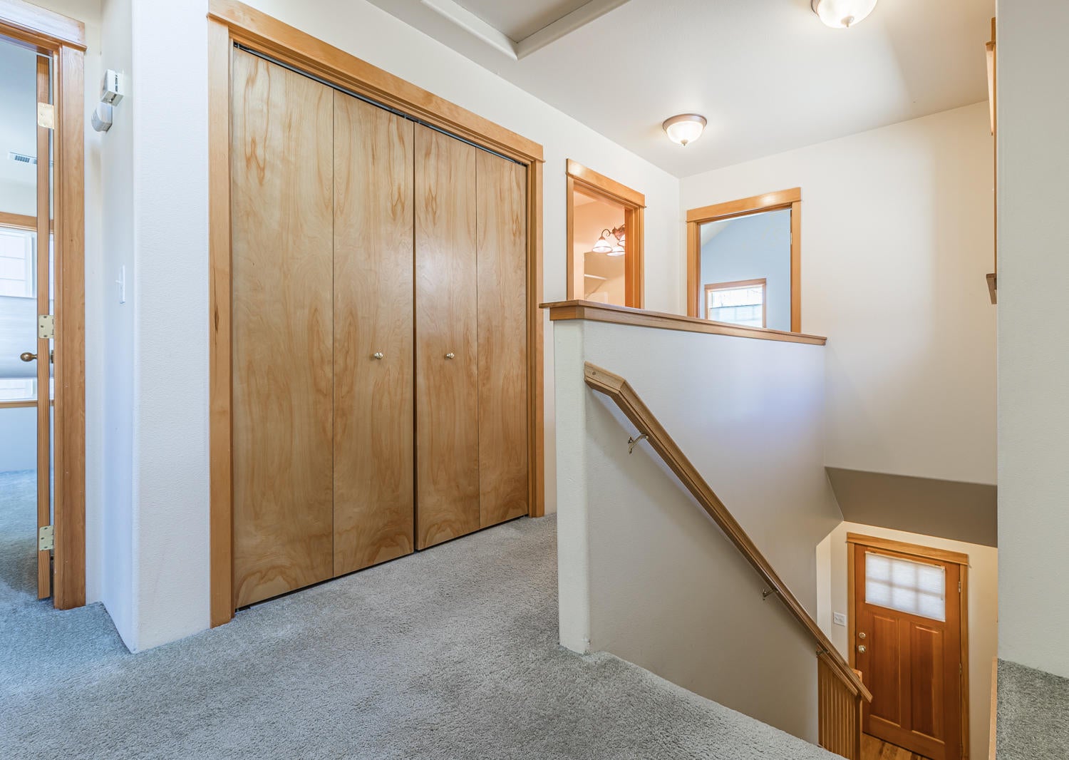22 Logan Way Talent, OR 97540 - Photo 13 of 27 Upstairs hallway with master bedroom on one side of the home.
