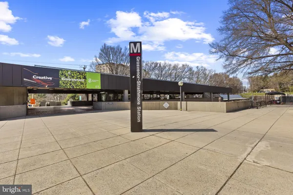 a view of a patio with iron stairs