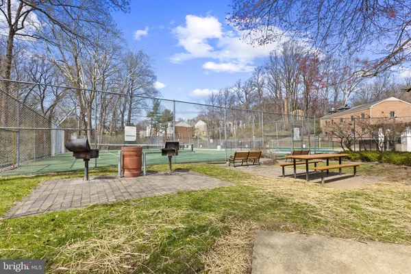 a swimming pool with outdoor seating and yard