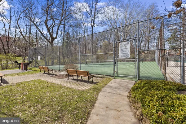 a view of a park with bench in a park