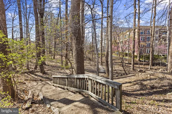 a view of balcony with wooden floor and fence