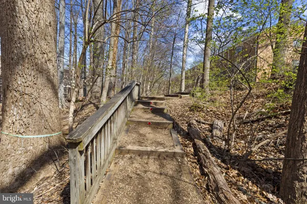 a view of entryway with wooden stairs