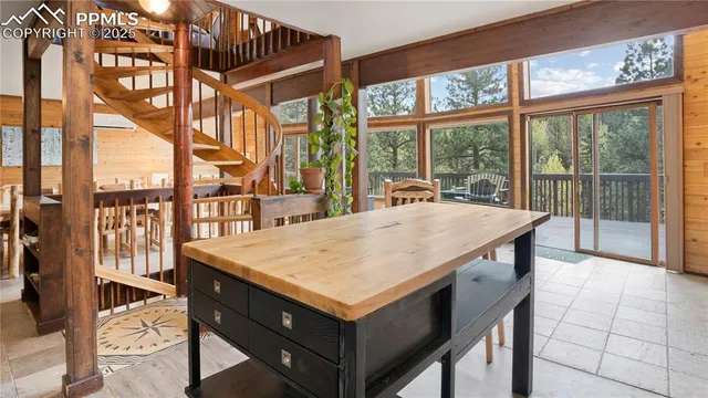 a dining room with a large window and table