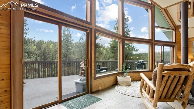 a view of a room with furniture and balcony