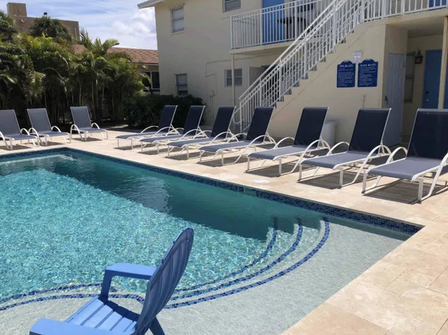 a view of swimming pool with outdoor seating