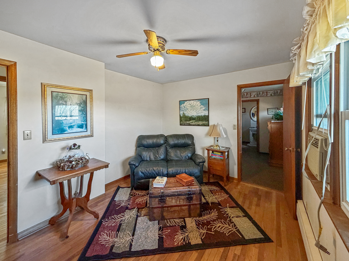 6057 North Lake Road Lena, IL 61048 - Photo 14 of 22 a bed room with furniture and a table