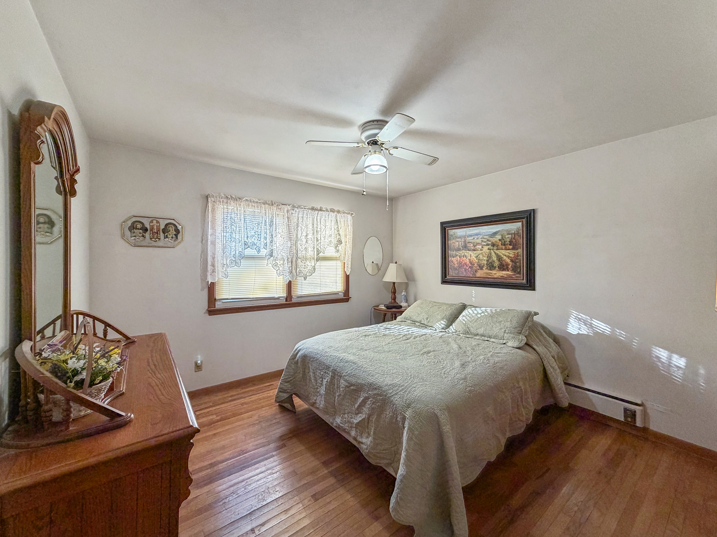 6057 North Lake Road Lena, IL 61048 - Photo 15 of 22 a bedroom with a bed table and window