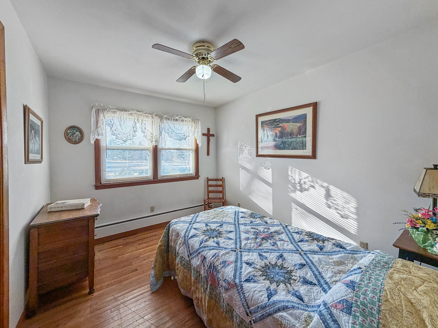 6057 North Lake Road Lena, IL 61048 - Photo 17 of 22 a bedroom with a bed and wooden floor