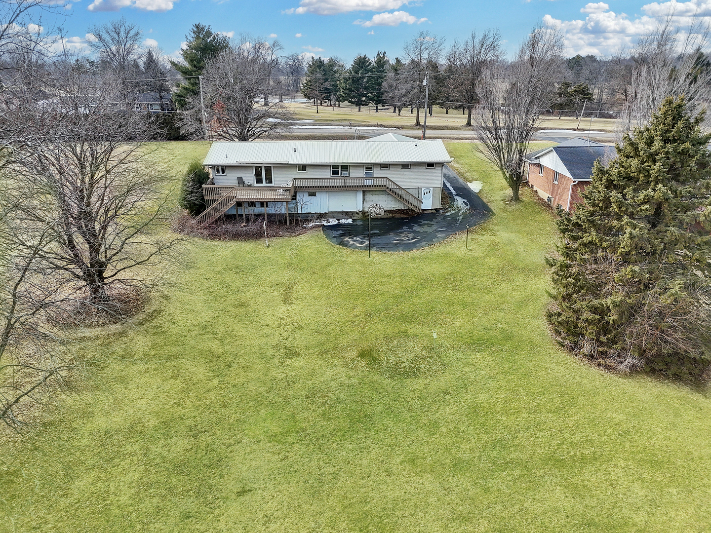 6057 North Lake Road Lena, IL 61048 - Photo 3 of 22 a view of a swimming pool with lawn chairs and plants