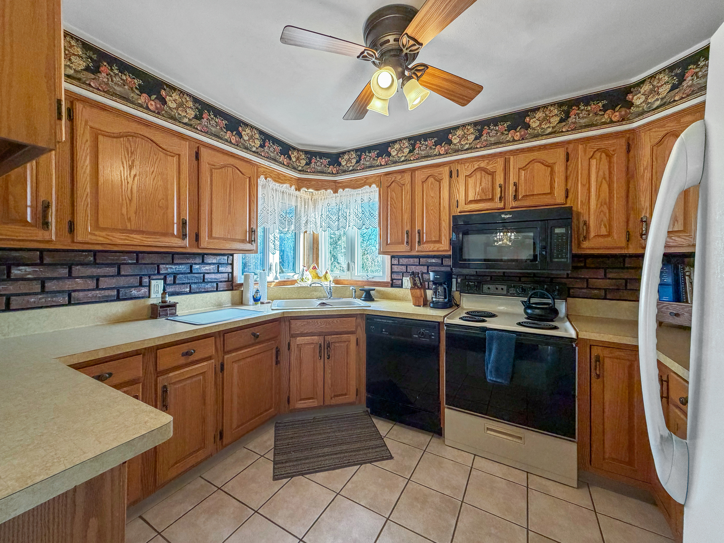 6057 North Lake Road Lena, IL 61048 - Photo 4 of 22 a kitchen with stainless steel appliances granite countertop a stove cabinets and a sink