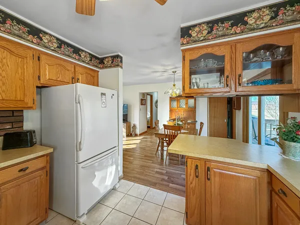 a kitchen with a refrigerator a stove and a sink
