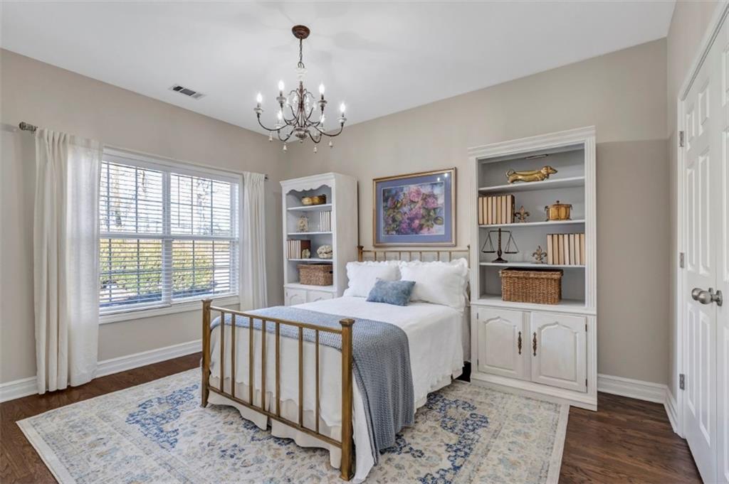 1075 Julius Drive Suwanee, GA 30024 - Photo 15 of 21 a bedroom with a large bed and a window