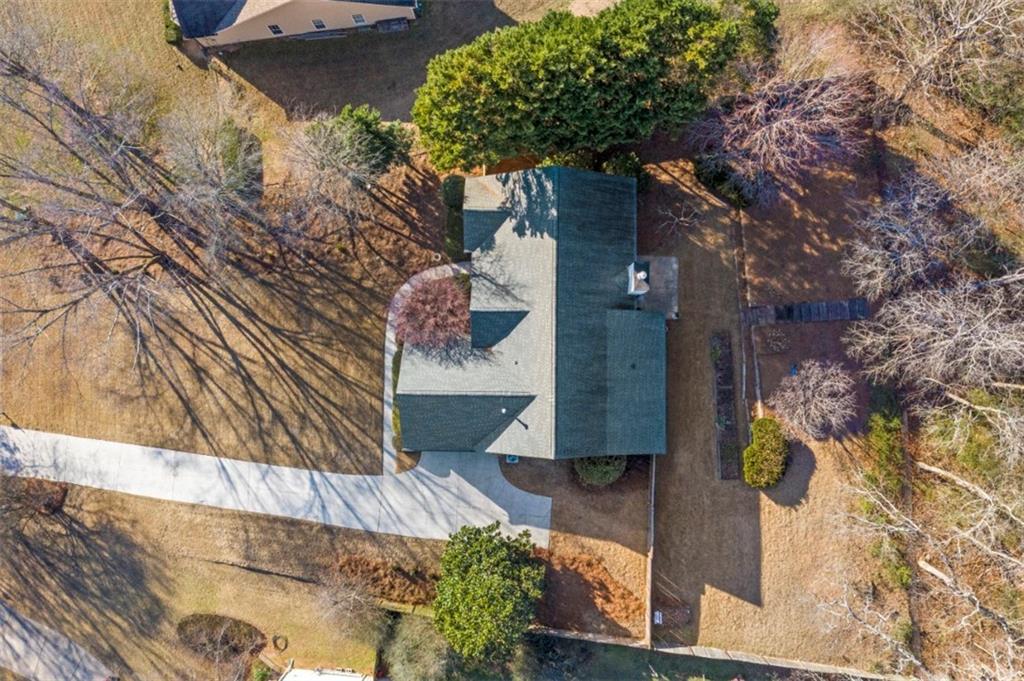 1075 Julius Drive Suwanee, GA 30024 - Photo 19 of 21 a picture of a house with a tree