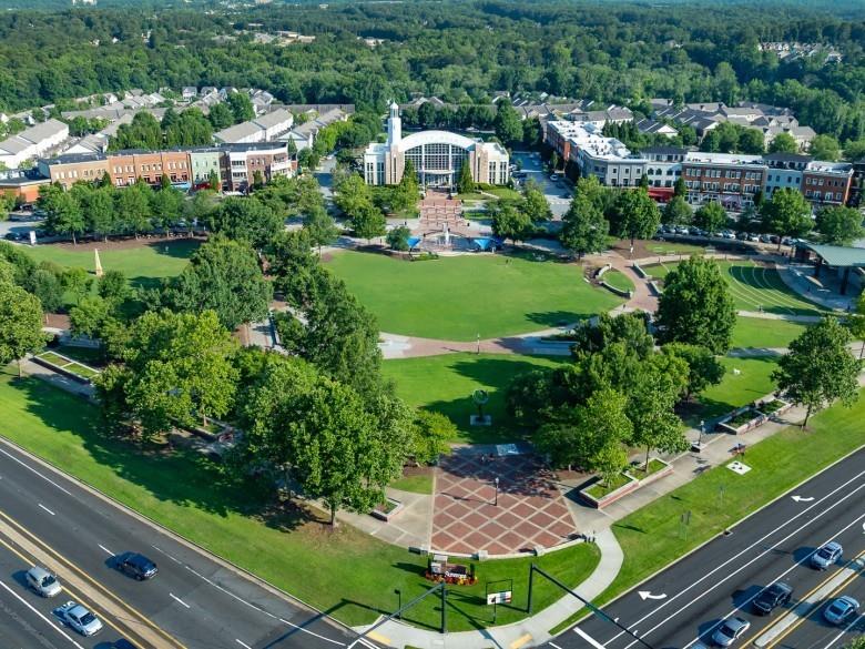 1075 Julius Drive Suwanee, GA 30024 - Photo 21 of 21 a view of a garden with plants and large trees