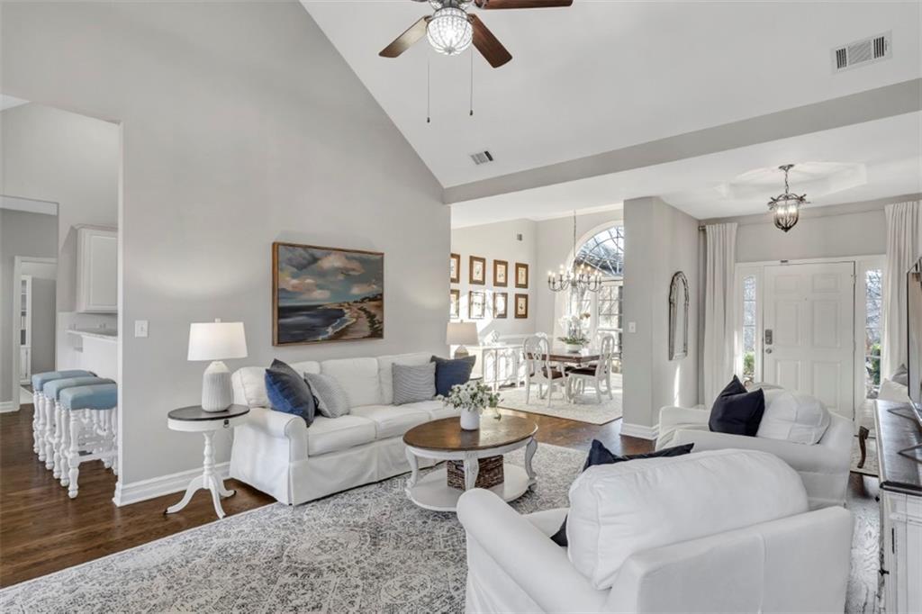 1075 Julius Drive Suwanee, GA 30024 - Photo 5 of 21 a living room with furniture and a chandelier