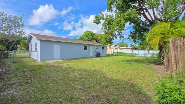 a backyard of a house with lots of green space