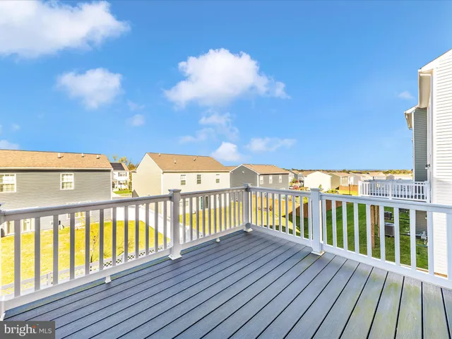 a view of balcony with wooden floor