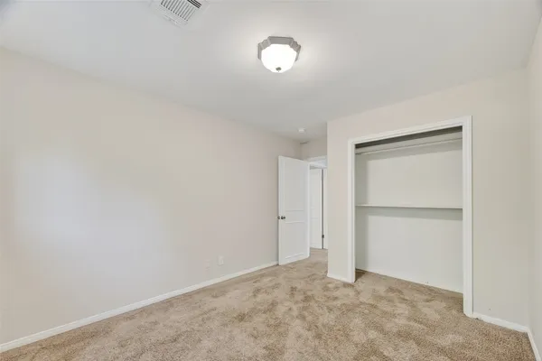 an empty room with a windows