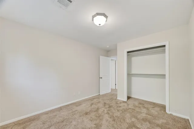 an empty room with a windows