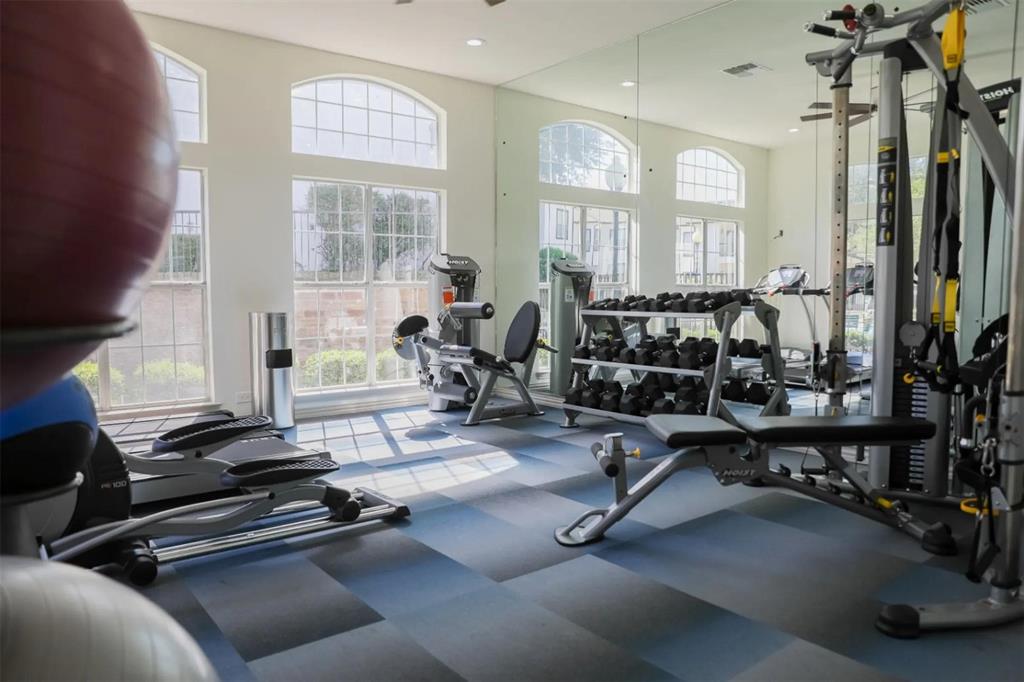 1600 North 9th Street, Unit A1R Midlothian, TX 76065 - Photo 13 of 40 a room with gym equipment and windows