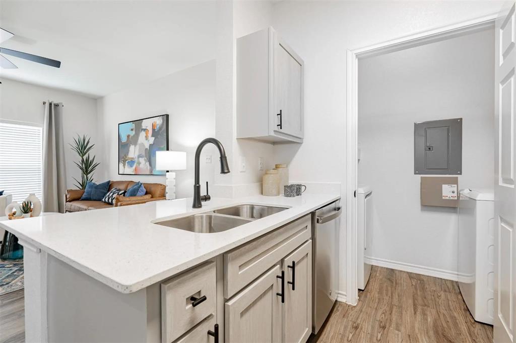 1600 North 9th Street, Unit A1R Midlothian, TX 76065 - Photo 40 of 40 a kitchen with a sink and a wooden floor