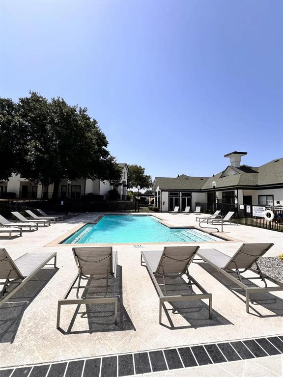 1600 North 9th Street, Unit A1R Midlothian, TX 76065 - Photo 4 of 40 a view of a swimming pool and lounge chairs
