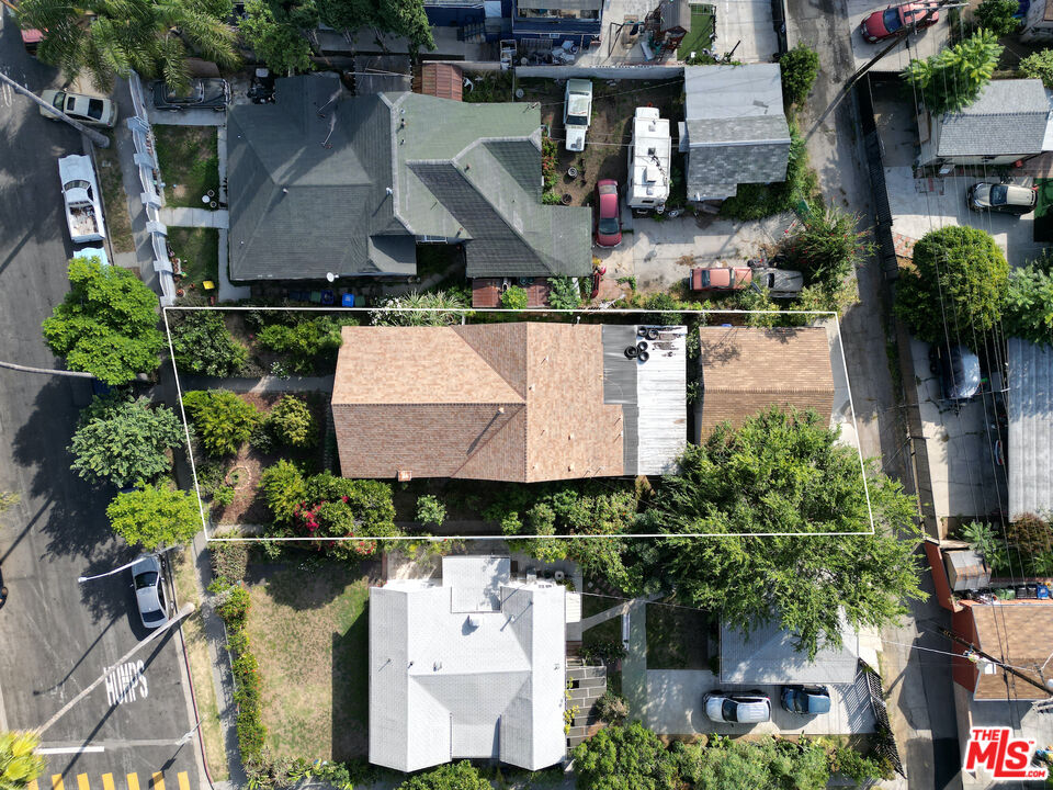 an aerial view of multiple houses with outdoor space